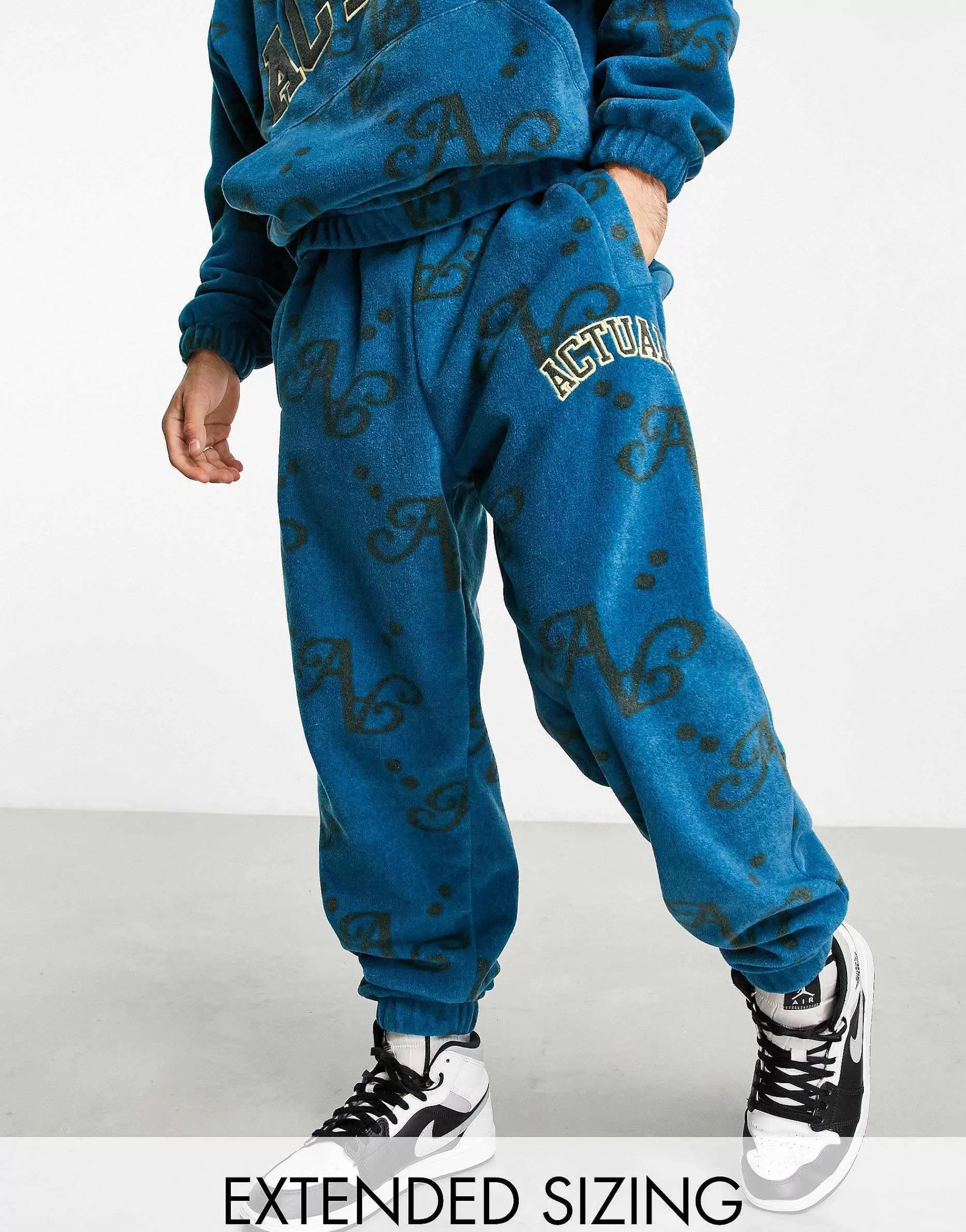 Men DESIGN Actual Co-Ord Relaxed Polar Fleece Joggers With All Over Print And Applique Logo In