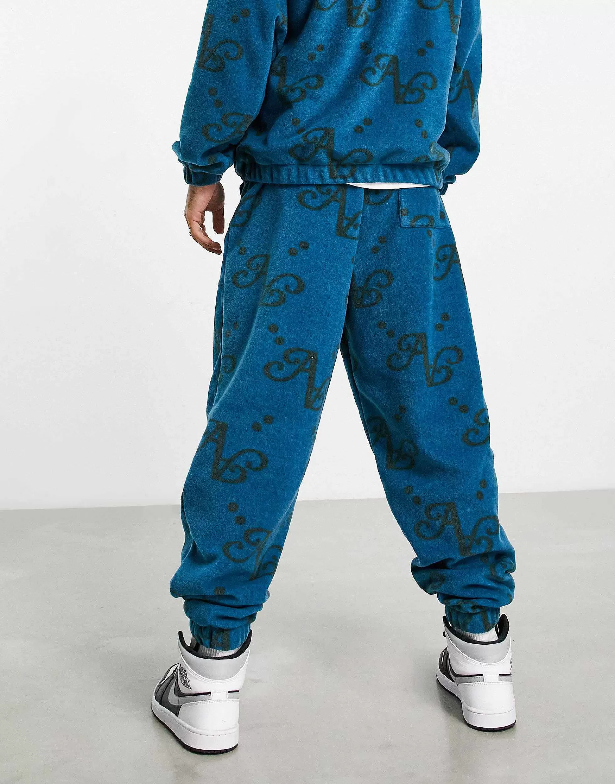 Men DESIGN Actual Co-Ord Relaxed Polar Fleece Joggers With All Over Print And Applique Logo In